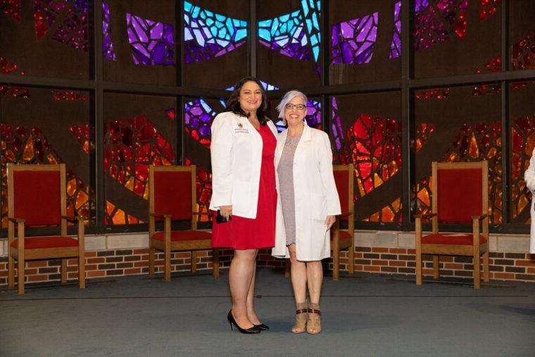 Veronica with Dr. Tina Butler standing in Logsdon Chapel.